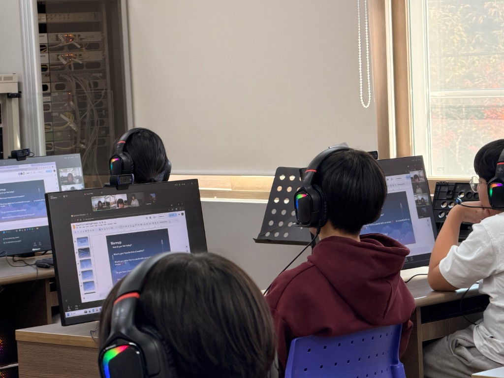 Students at computers near the window