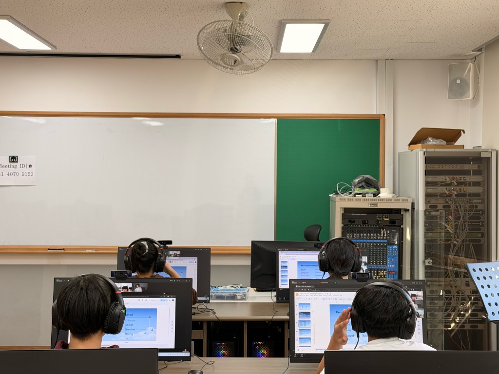 Students at computers from behind during Zoom class